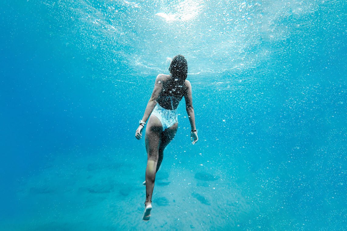 Woman underwater wallpaper by Jeremy Bishop