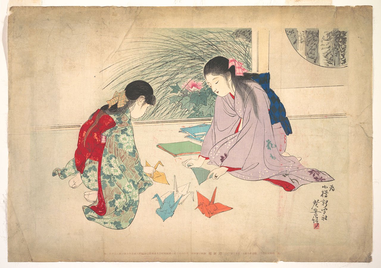 Young Girls Making Origami Cranes